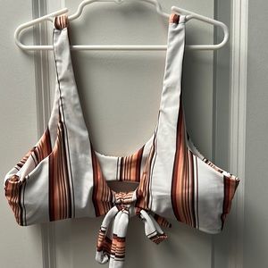 Bikini top with brown and orange strips with a tie in the middle, size small